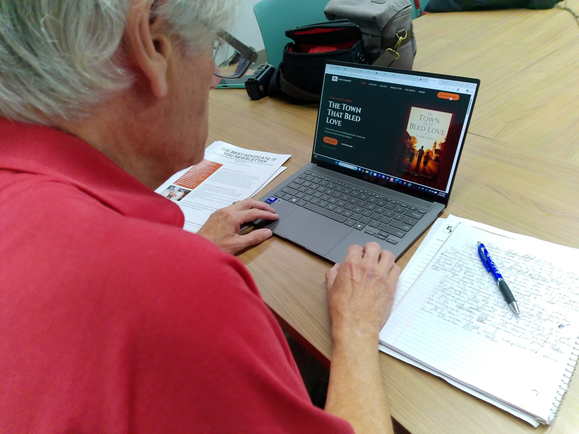 Eddie Harbert writing and working on his advocacy newsletter